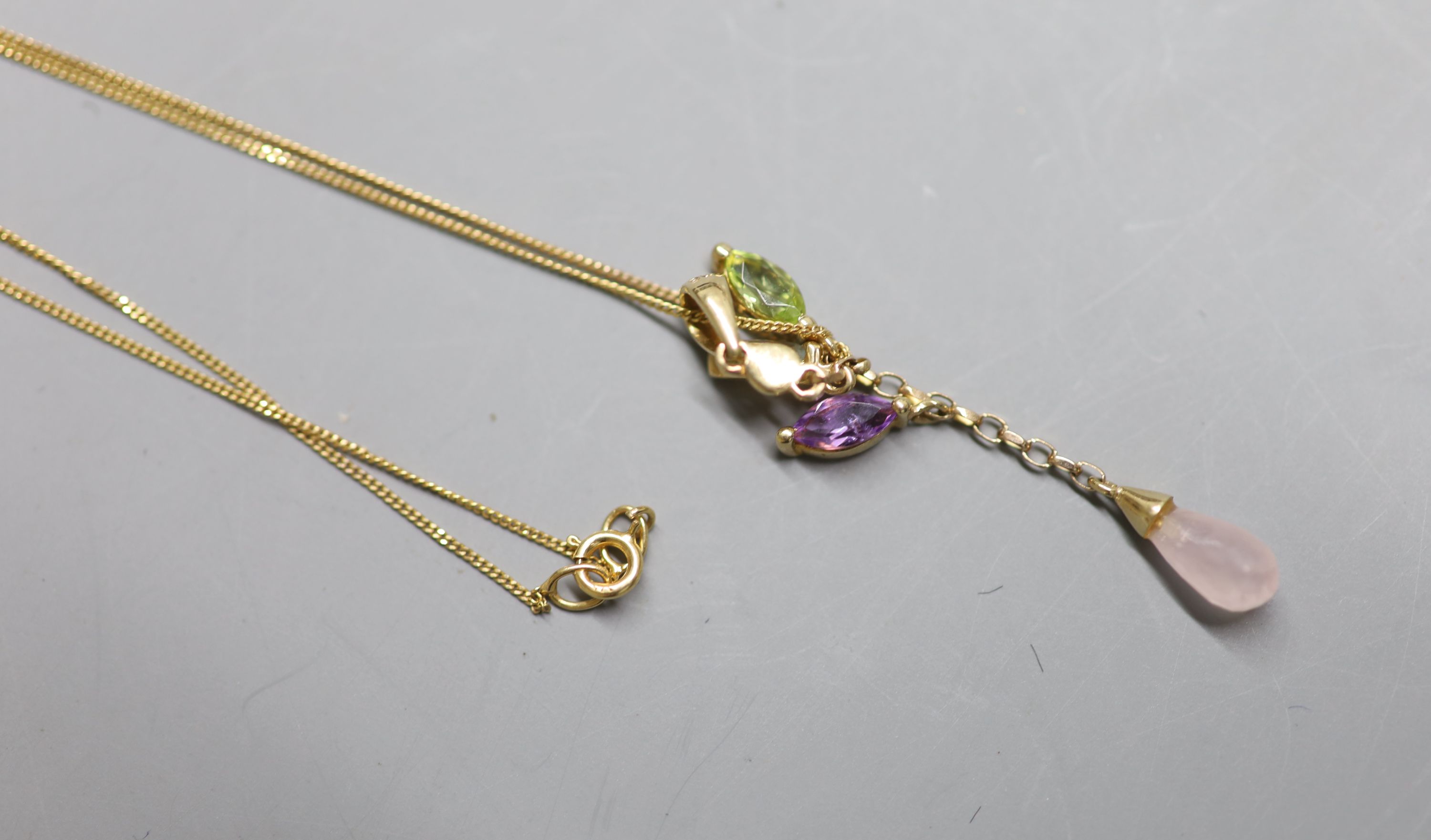 A modern 9ct gold and multi gem set drop pendant, 38mm, on a 9ct gold fine link chain (knotted), gross 1.7 grams.